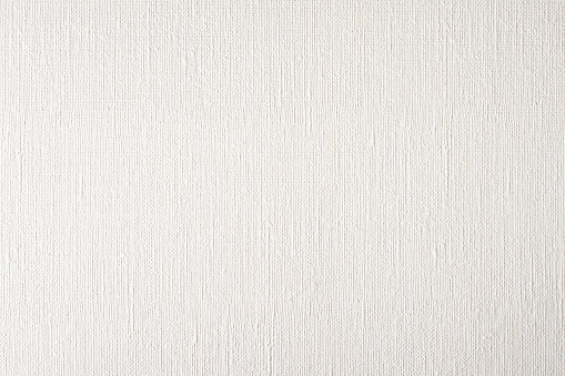 A blank background of a large area of blank, unused canvas paper.