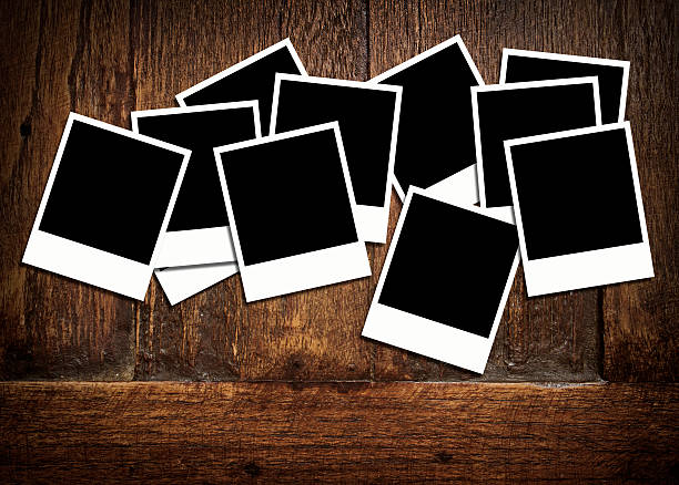 istock blank instant photos on old wood background with copy space 177274597