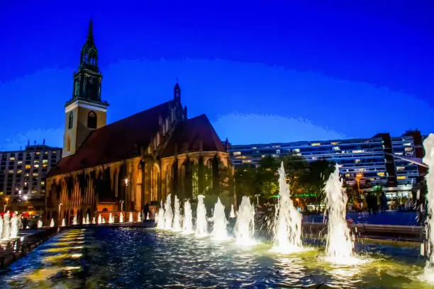Fantastic view on Church St.Marienkirche  and blue sky of twilights and  blurred  water of fountains in street lights  of Berlin. Blurred motion people of long exposure
 - downtown of German capital