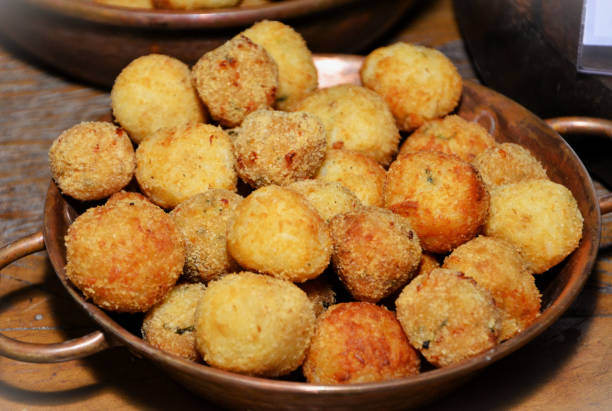 istock Snack of rice balls with mozzarella on the table 1772749792