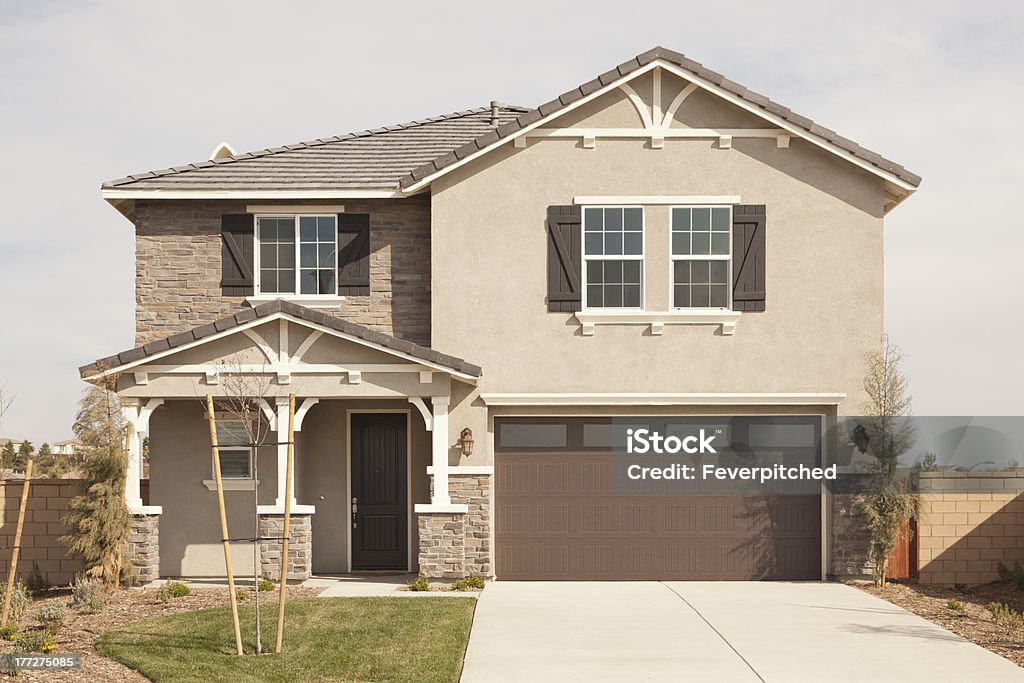 Newly Constructed Modern Vacant Home Facade A Newly Constructed Modern Vacant Home Facade and Yard. Residential Building Stock Photo