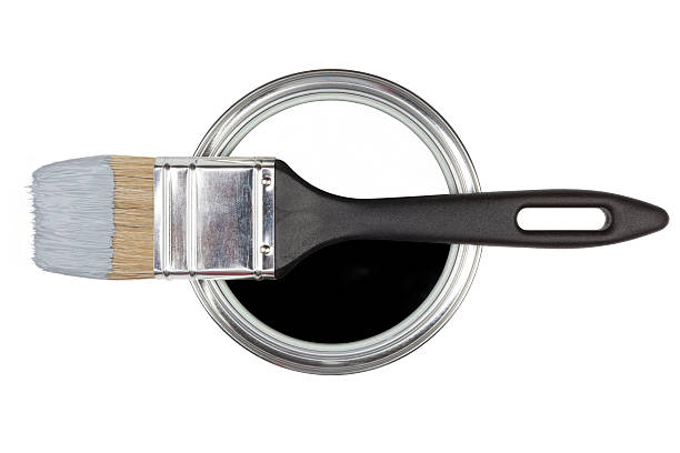 a freshly mixed can of blue paint and brand new brush isolated on white