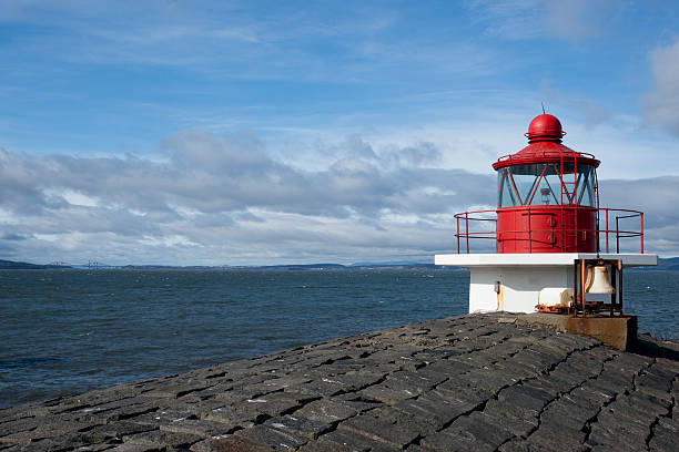 istock Lighthouse on the end of breakwater 177275218