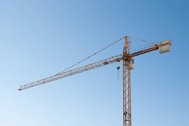 Crane against blue sky stock photo