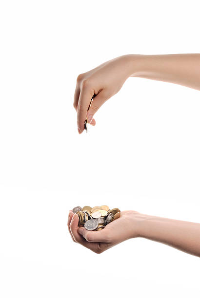 istock woman`s hands with heap of money 177275618