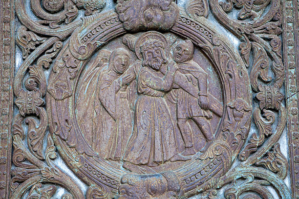 Paris - detail from main portal of Saint Denis first gothic cathedral - Jesus under cross