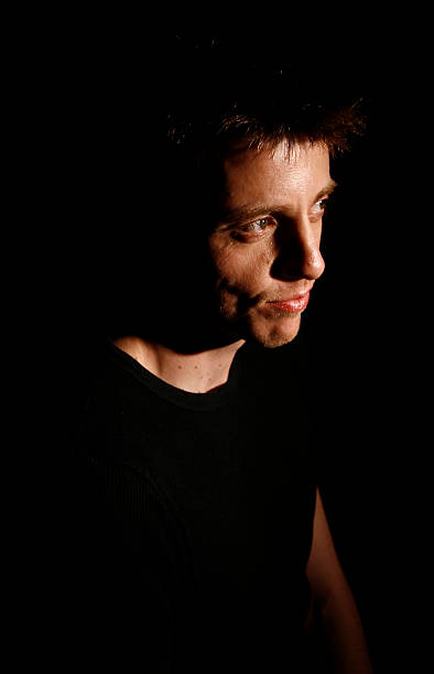 istock portrait of man with black background 177276329