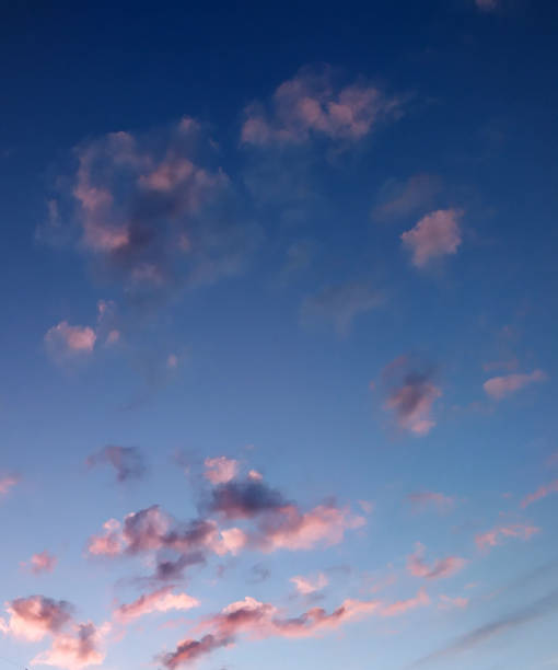 clouds in shades of pink 2 stock photo