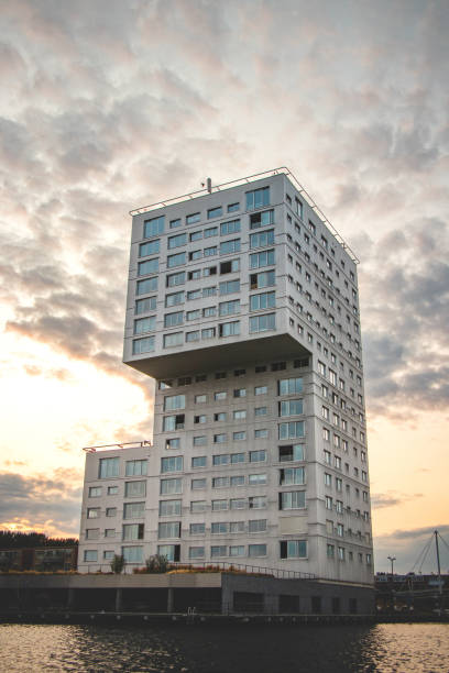 istock Dutch skyscraper design in Almere during sunrise, Netherlands. Dutch modern construction 1772775554