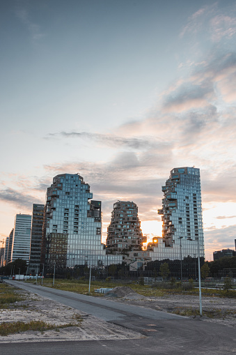 Unique U-shaped skyscraper design with family houses on top of each other called angular Valley skyscraper, Amsteradam Zuid, Netherlands.