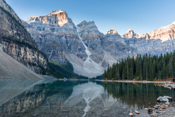 Moraine Lake Sun hitting the Valley of Ten Peaks from Moraine Lake, Banff. moraine lake stock pictures, royalty-free photos & images