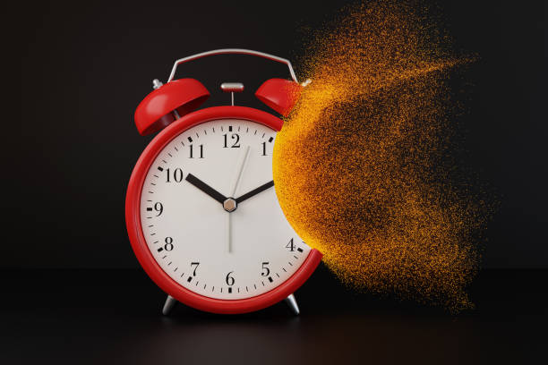 red alarm clock dissolving into orange particles on black background. illustration of the concept of time flies - clock time alarm clock orange imagens e fotografias de stock