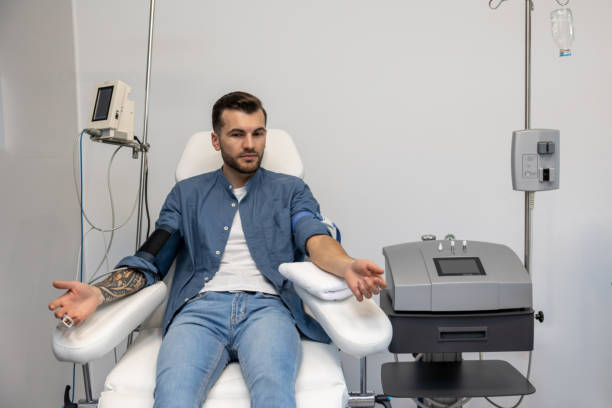 istock Man preparing for insertion of drip in clinic. 1772781321