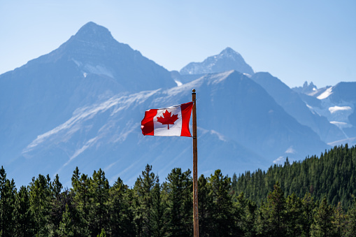 Canadian flag flying in the wind along the Icefields Parkway, Banff