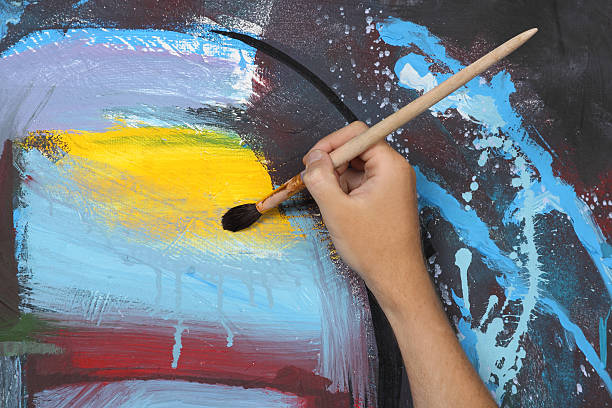istock man hand painting blue abstract picture 177278327