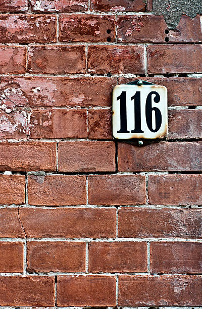 istock House number on old brick wall 177278622