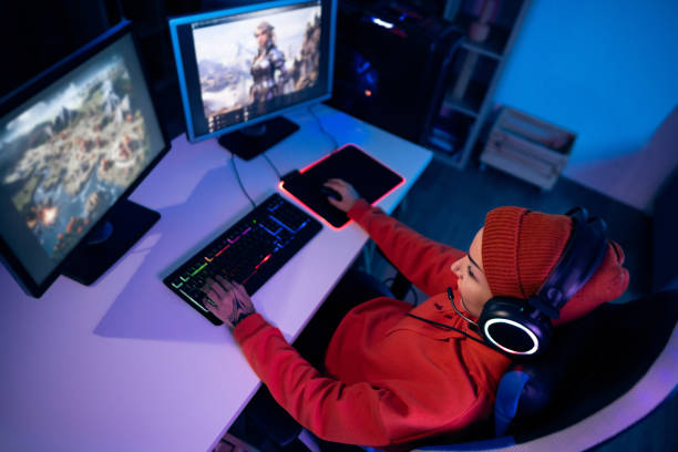 istock Modern young Caucasian female gamer playing video games on computer 1772800673
