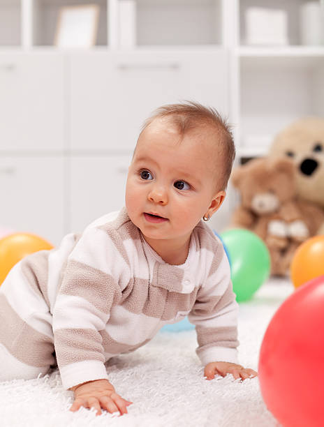 istock Baby girl with balloons 177280541