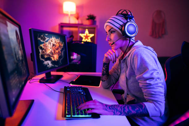 istock Focused female gamer, playing strategy video games on her PC during a live stream 1772807979