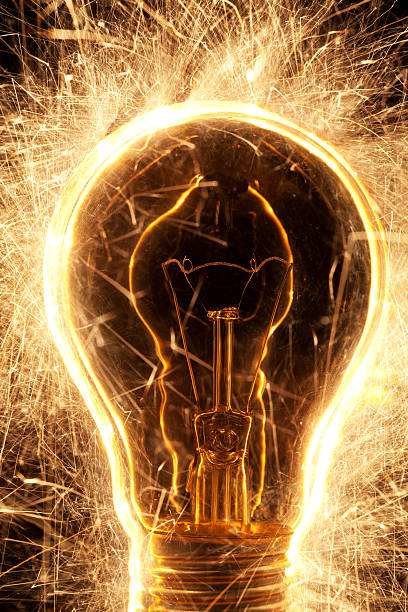 istock bulb and sparklers   on black background 177281209