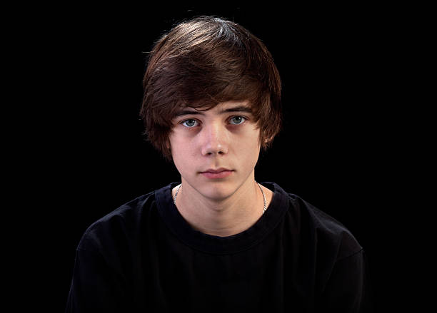 istock Sad teenager portrait on black 177281269