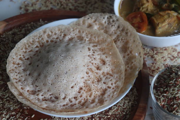 istock Rajamudi rice appam served with kerala chicken curry. 1772815169