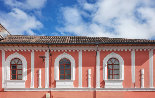Street view of an old colonial building facade in Quito, Ecuador. stock photo