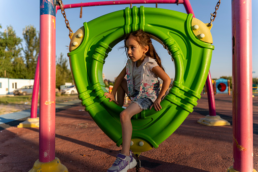Girl having fun in the playground.