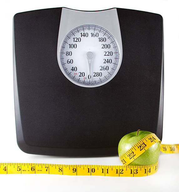 istock Apple with a measuring tape and scale 177283632