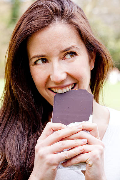 istock Woman eating chocolate 177283794