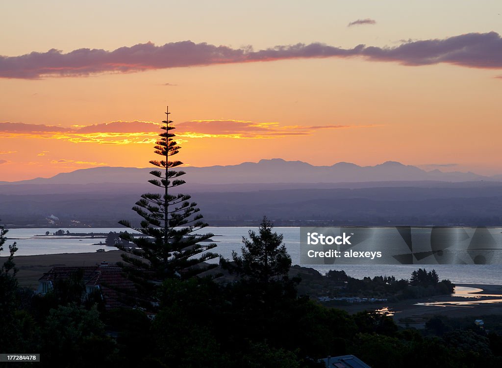 Sunset over bay "Beautiful sunset view over Tasman Bay in Nelson, New Zealand" Bay of Water Stock Photo