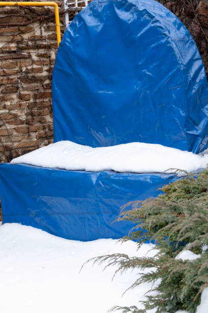 istock Fountain in winter courtyard covered with blue cover 1772848496