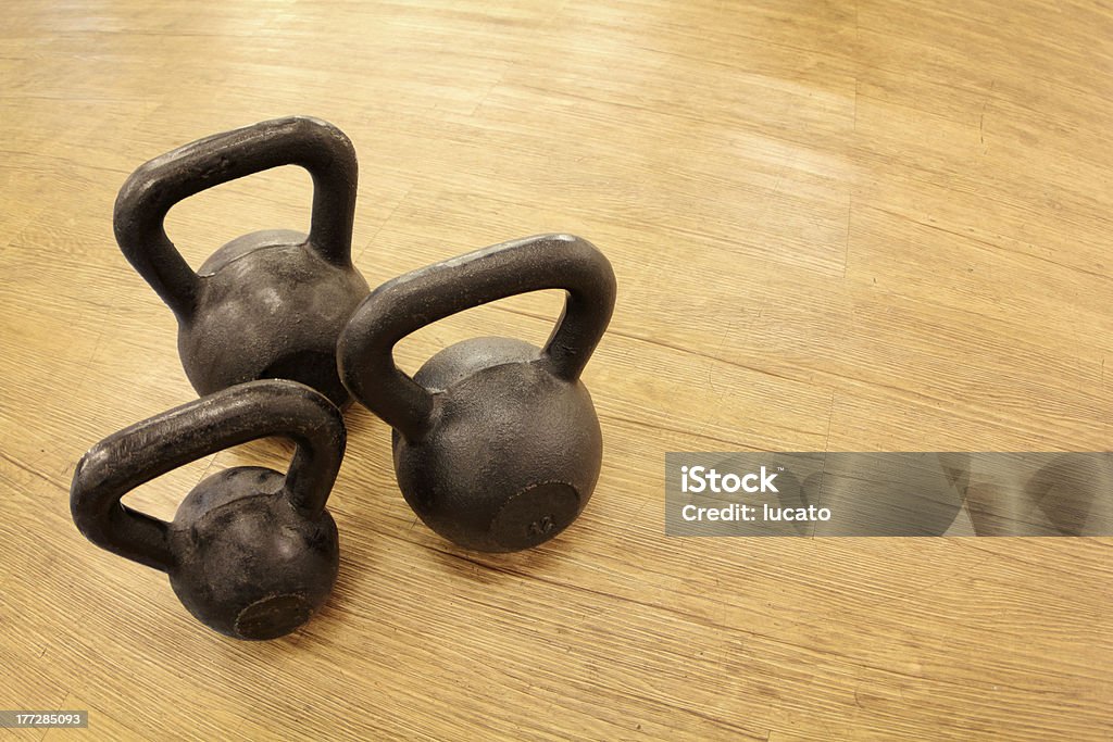 Kettlebell weights Kettlebell weights on the floor at the gym.See my miscellaneous images serie by clicking on the image below: Anaerobic Exercise Stock Photo