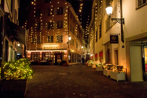 Zurich, Switzerland - December 8, 2022: Street decorated for Christmas in old city of Zurich, Switzerland