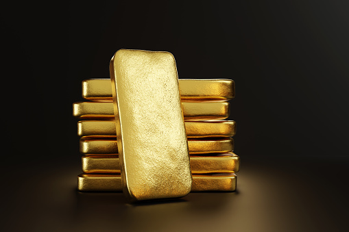 Gold bullion leaning on a stack of gold ingots. Illustration of the concept of precious metal trade and wealth