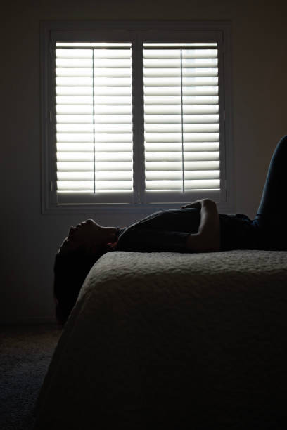 istock Woman laying on bed looking up 1772866757