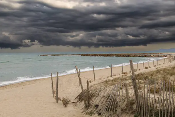 Photo of the vermilion coast under a stormy sky