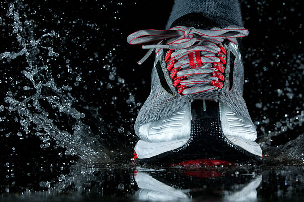 istock Running shoe splashing water 177287727
