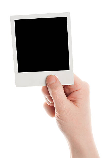 istock One instant photo in hand 177287891