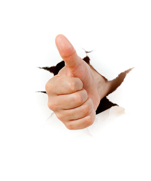 istock Hand giving a thumbs up bursting through a white background 177288639