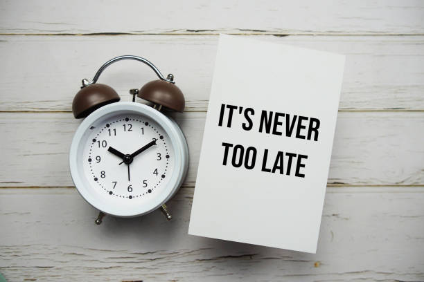 istock It's never too late text message with alarm clock top view on wooden background 1772886856