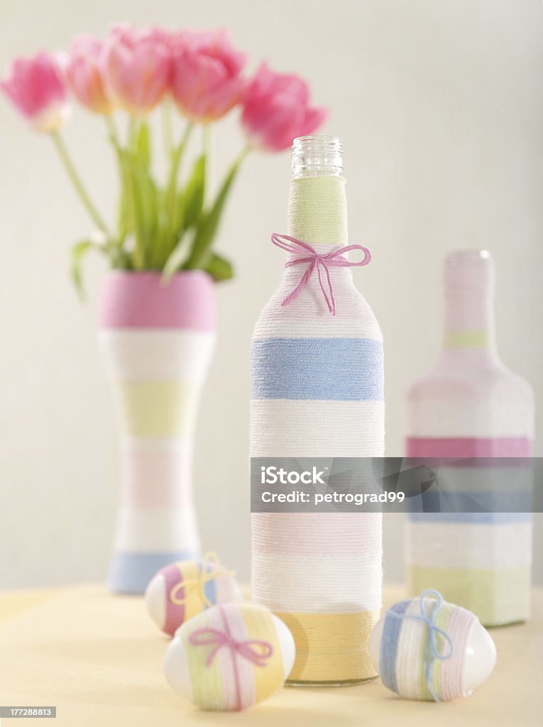Pink tulips, Easter eggs and yarn wrapped bottle "Pink tulips, Easter eggs and handmade yarn wrapped bottle" Blossom Stock Photo