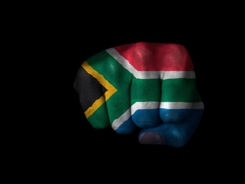 Flag of South Africa painted on closed fist. See other