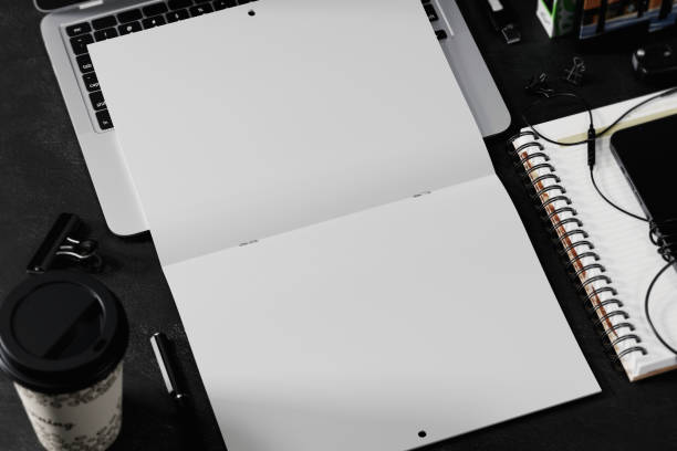 istock Opened saddle stitch calendar on laptop mockup. 3D rendering 1772899626