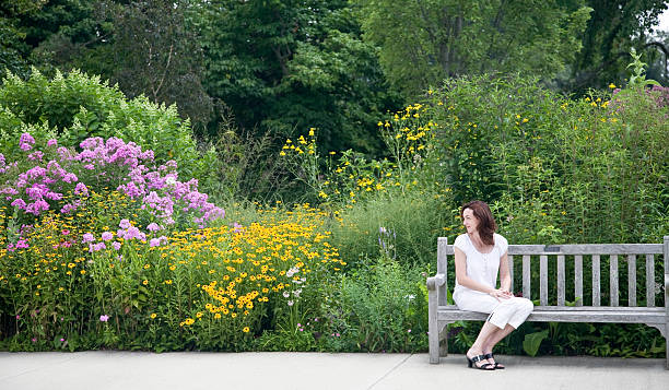 istock Woman on Bench at Park 177290220