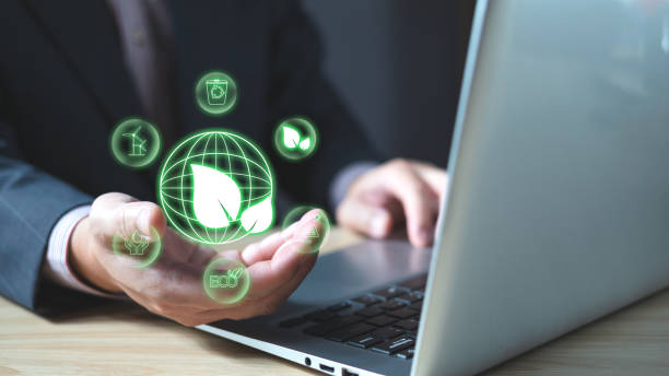 istock hand use laptop to save energy,and reduce global warming,climate change,ecology friendly investment,ESG environment social governance,Green Business Innovation and Sustainable Development concept. 1772905227