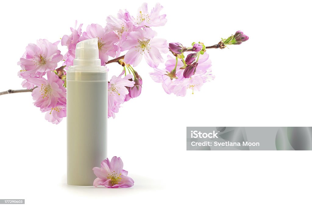 Daily skin care concept: face cream with sakura flowers Anti Aging Stock Photo