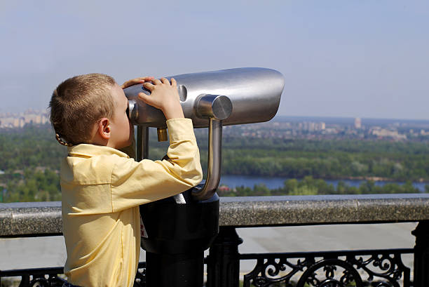 istock Boy with telescope on panorama terrace 177290663