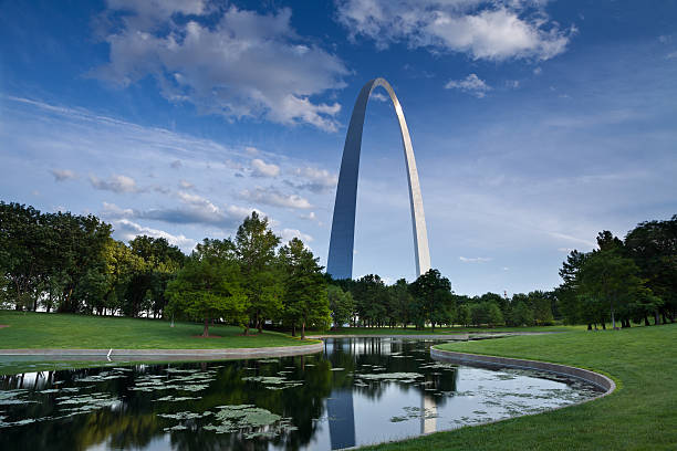istock A gateway arch in a park with green grass and a pond 177291305