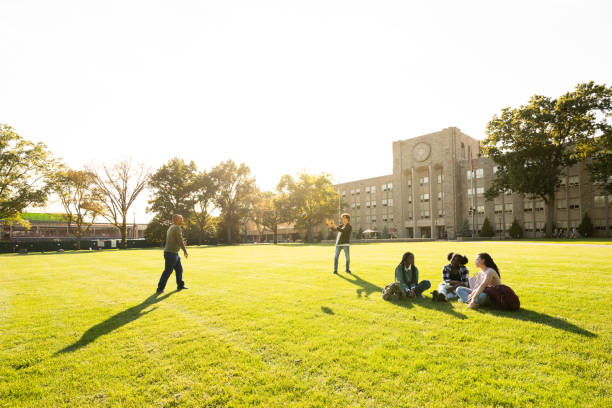 istock University students passing a football 1772922739
